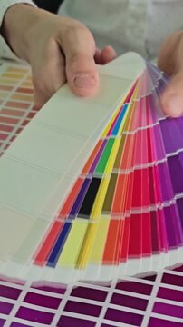 Color matching process in a design studio using color swatches and charts