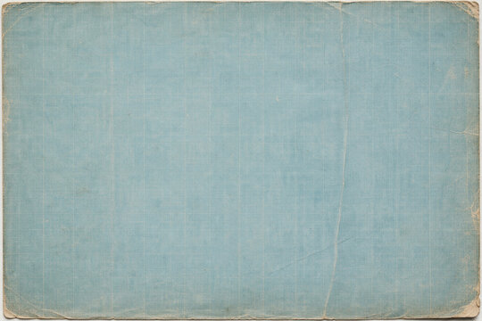 Vintage blueprint paper with faded blue grid lines, worn edges, creases, and blank drafting surface for technical layouts.
