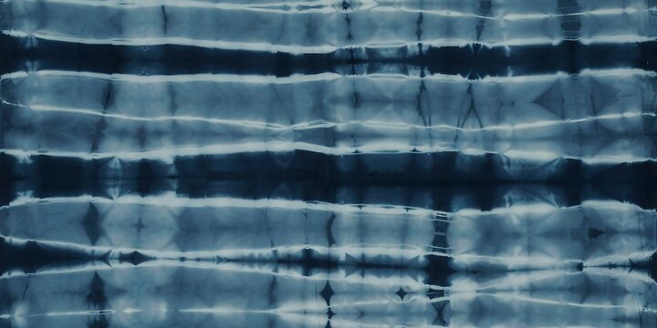 Dark blue shibori tie dye fabric pattern with horizontal lines and organic texture