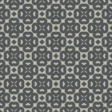 Geometric pattern features repeating dark grey shapes on a light grey background. Symmetrical motifs create a visually balanced, modern design. Pattern evokes classic tilework or textile aesthetics