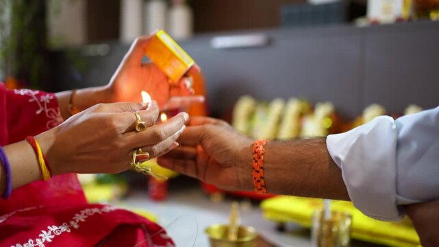 Close-up of Hands Performing a Traditional Hindu Ritual