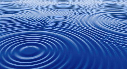 Fototapeta premium Blue water ripples spread across a dark surface. Circular wave patterns radiate outwards from several points, creating a mesmerizing visual effect.
