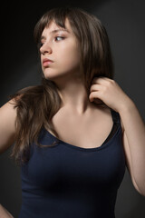Fototapeta premium Beautiful Teenage Girl Portrait Beauty and Youth Concept on Dark Background