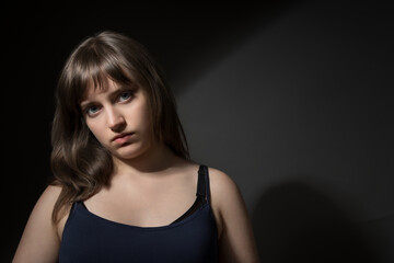 Fototapeta premium Beautiful Teenage Girl Portrait on Dark Background Beauty Concept