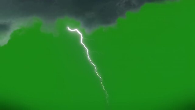 Electric lightning strikes during a stormy dark sky with dramatic cloud formations and green screen background for compositing
