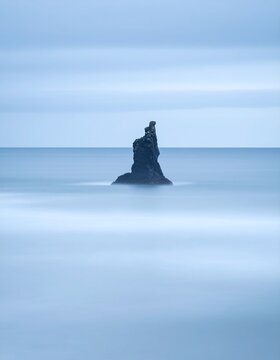 ingle Sea Stack against Misty Horizon