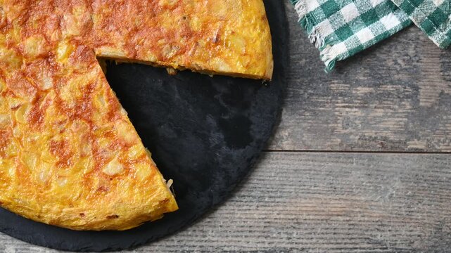 Taking a slice of Spanish potato omelette