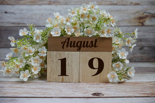 Wooden Calendar Showing the Date of August 19th. Day 19 of August month