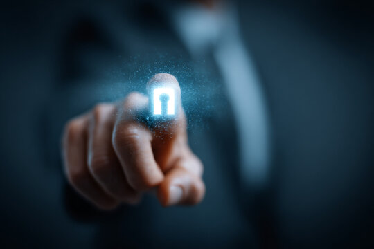Businessman hand pointing touching glowing digital security keyhole icon concept of data protection access control personal privacy modern internet technology corporate network safety background.