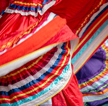 Background with a Mexican dancer's dress while dancing.