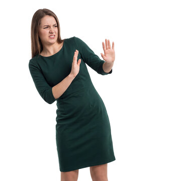 woman disgusted rejecting pushing away transparent background isolated green dress leans back with raised palms for aversion refusal unpleasant surprise boundaries and negative reaction campaigns