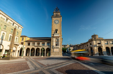 Torre dei Caduti Clock Tower and Piazza Vittorio Veneto City Square in Bergamo Italy Illuminated by Morning Sunlight © Алексей Горовой