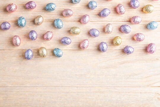 Chocolate easter eggs in coloured foil from above