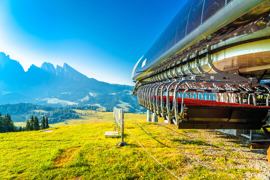 The Mezd&igrave; Talstation and view of Seiser Alm alpine meadows from Mont Seuc. Alpe di Siusi.