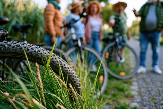 Eco tour guide with group beside bicycles on nature trail