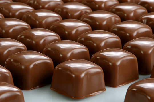 Chocolate candies arranged in a neat pattern