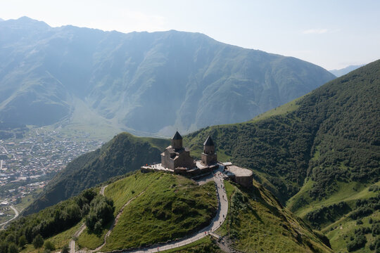Scenic view of Gergeti Trinity Church and the mountain valley of Stepantsminda