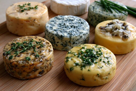 Cheese varieties on a wooden board