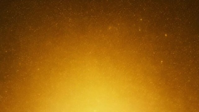 Golden glitter particles scattered on a gradient golden background