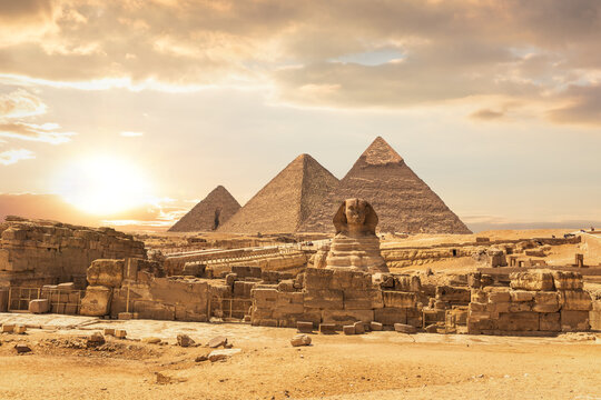 Great Sphinx of Giza and Ancient Pyramids in Egypt Desert Sunset Landscape