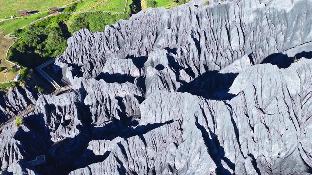Aerial view of sharp, jagged grey stone forest formations in Bamei Moshi Park, Garze, Sichuan, China.
