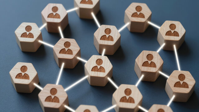 Hexagonal Wooden Blocks with Human Silhouettes Connected by Glowing Lines &ndash; Decentralized Organizational Network Structure for Business Charts, Social Connection Concepts, and Team Management Visuals