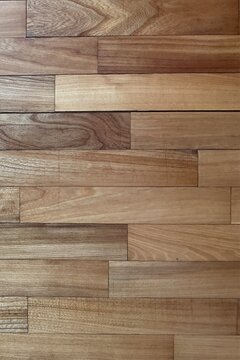 Vertical background featuring the natural texture of light brown laminate.