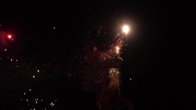 Chinese dragon performing at night.