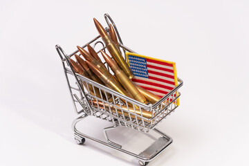 Mini shopping cart filled with rifle cartridges and American flag patch © Anelo