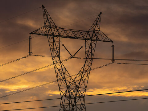 Electric pole against a summer sunset