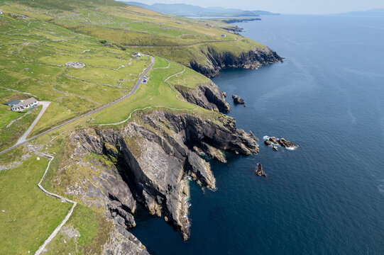 Drone aerial scenery of Dramatic cliffs and fahan beehive huts. Slea head drive wild atlantic ocean way Ireland. Irish landscape