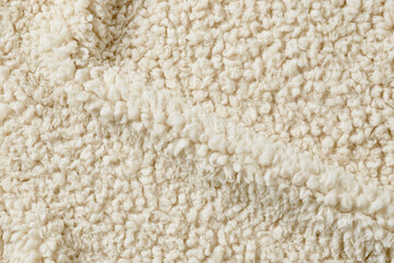 Abstract macro shot of cozy white curly wool texture © Clint