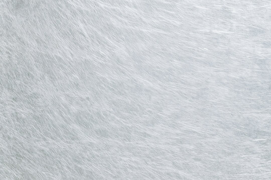 Abstract silver brushed metallic texture with light reflections