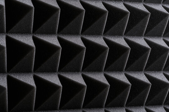 Black acoustic foam panel texture with pyramid pattern for soundproofing studio