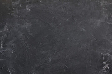 Blank blackboard texture background with chalk traces and scratch marks © Clint