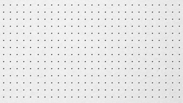 Macro view of white pegboard surface with repeating hole pattern surface texture backdrop texture industrial des