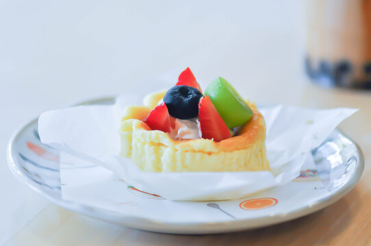 cheesecake with fruit topping or basque cheesecake with fruit topping, piece of cake