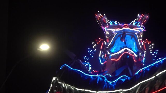 Chinese dragon performing at night.