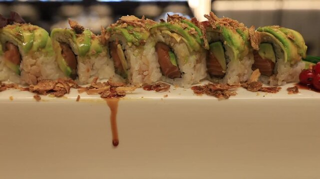 The chef prepares sushi dishes