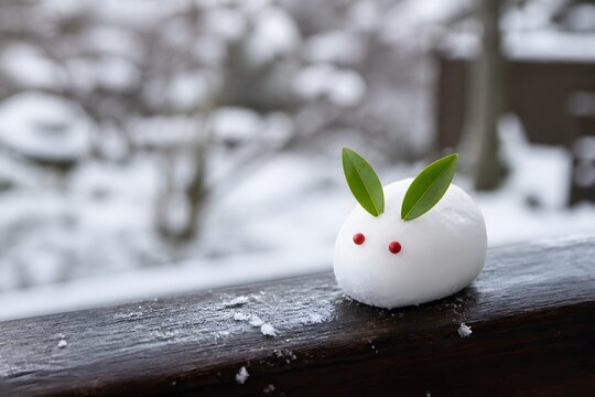 Japanese yuki usagi snow rabbit with red berry eyes on railing