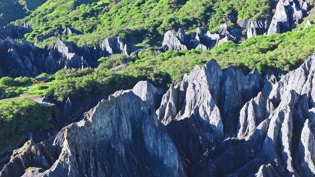 Aerial view of sharp, jagged gray stone forest formations in Bamei Moshi Park, Garze, Sichuan, China