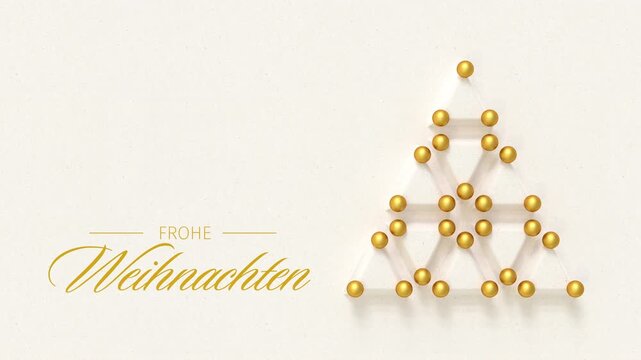 Christmas tree made from embossed paper triangles and golden baubles. German language Merry Christmas message (Frohe Weihnachten) appearing and dissolving. Loopable video