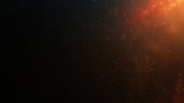 Abstract dark background with orange light leak and dust particles, cinematic film texture