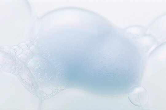 Mound of soft blue soap foam on a pale surface with visible iridescent bubbles and airy textures for cosmetic and cleaning product packaging