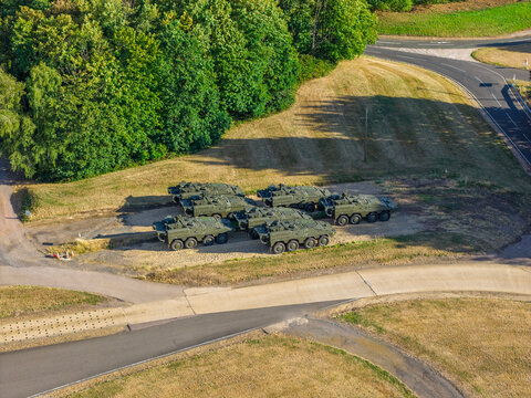 Military Armored Vehicles Parked at a Vehicle Testing Facility on a Sunny Day