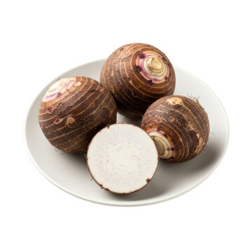 A plate of taro root tubers with one cut in half