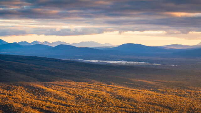 Mountain vista landscape in Grampians National Park, Victoria, Australia, during a bright, dramatic sunset with stormy clouds.