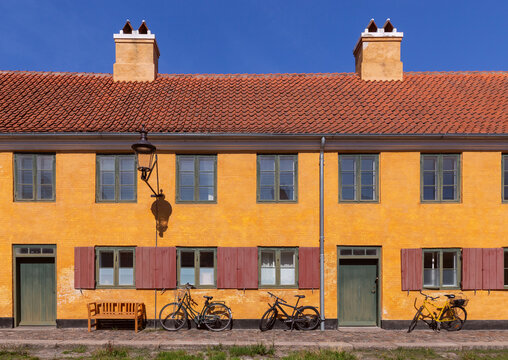 Yellow Historic Building with Bicycles in Copenhagen Denmark