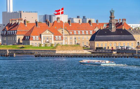 Historic Waterfront Buildings and Tour Boat in Copenhagen Denmark