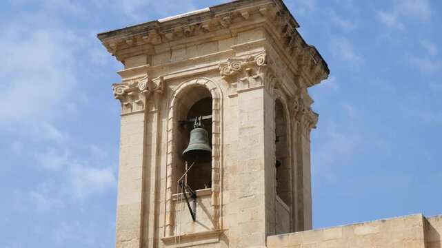 bronze bell hangs within the tower of knisja tal vittorja church of our lady of victory valletta's first ever building baroque campanile detail valletta first building great siege victory church